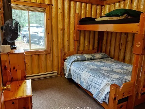 Cottage Log Suite bedroom at Ivanhoe River Inn in Sudbury, Ontario