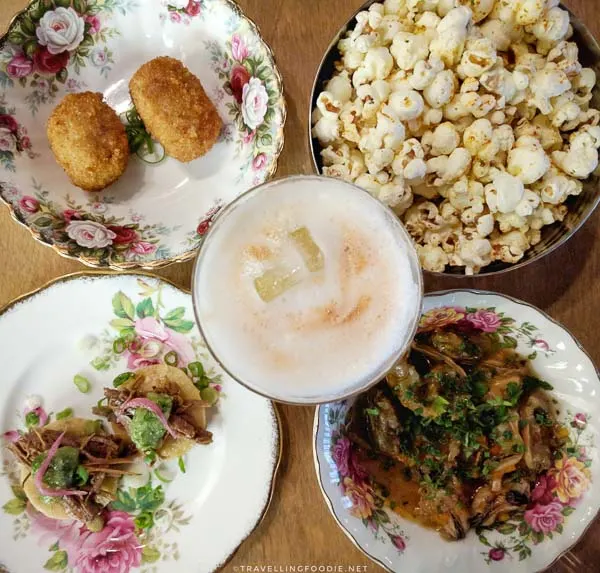 Popcorn, olives, mussels, beef tostada, whiskey sour at 11th Mile Restaurant in Fredericton, New Brunswick
