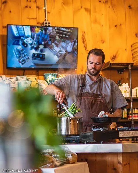 Chef Ben Leblanc-Beaudoin cooking asparagus at Iron Kettle Cooking Series Spring Thaw