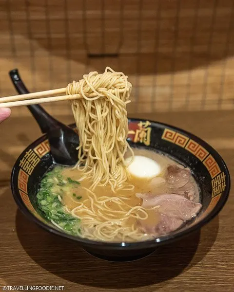 Noodle Lifting Ramen at Ichiran Ramen in Tokyo, Japan