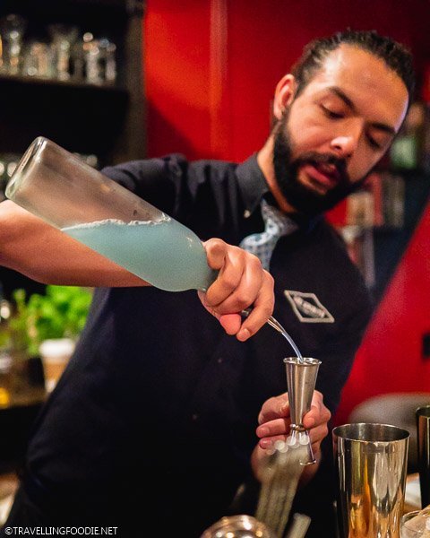 Bartender making Aviation Cocktail for Rocky Mountain Food Tours at Lee Spirits Distillery in Colorado Springs