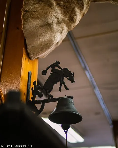 Cowboy Riding a Horse Bell at FM Light and Sons in Steamboat Springs