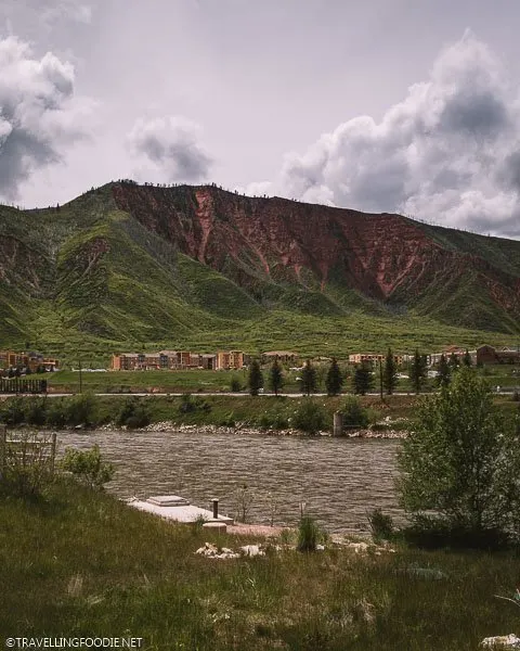 River, Colorful Buildings and Mountain Views at Iron Mountain Hot Springs