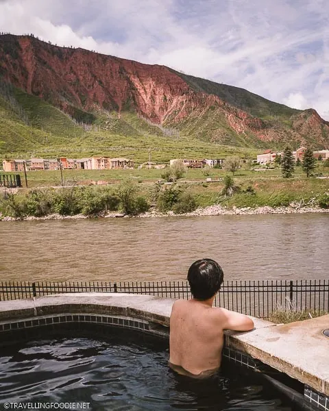 Travelling Foodie Raymond Cua looking away in hot springs at Iron Mountain Hot Springs