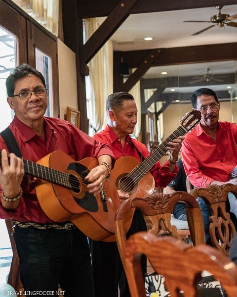 Three Musicians perform at a table at Ilustrado Restaurant in Manila