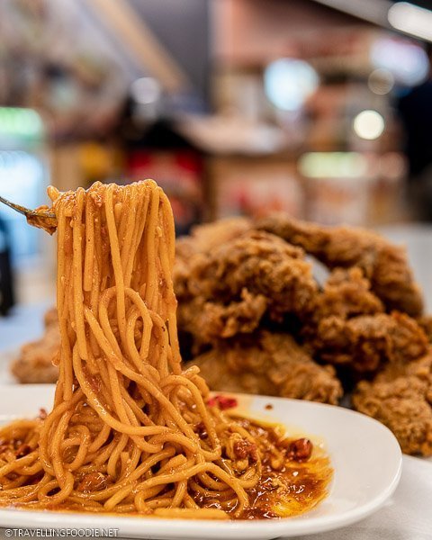 Lifting the Spaghetti at Kipp's Chicken in SM Megamall Food Court in Manila