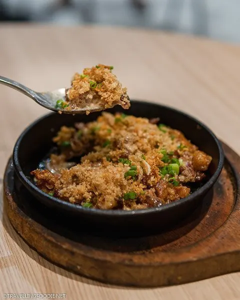 Scoop of Crispy Sisig at Manam, one of the best places to eat sisig in Manila