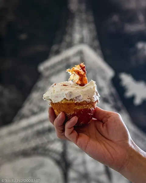Holding a Cheesecake in a Blanket with Eiffel Tower backdrop