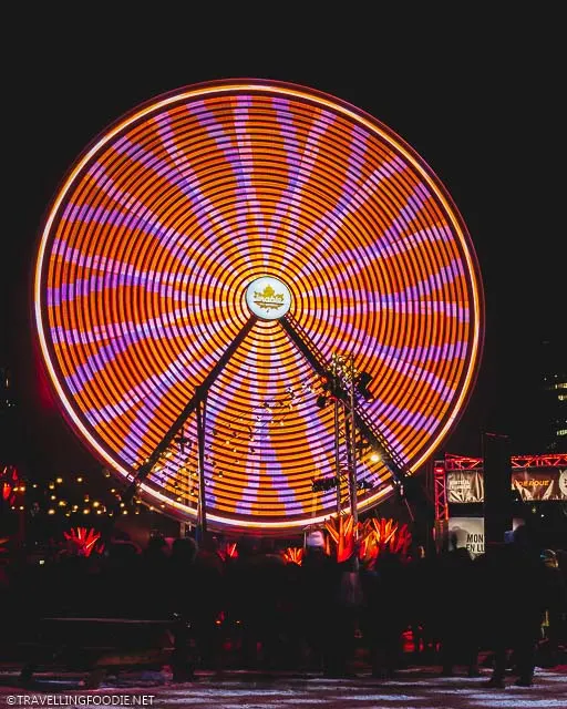 Quebec Maple Ferris Wheel at Night when moving during Montreal Festival of Lights