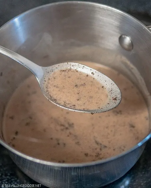 A spoon of Tablea Tsokolate from pot