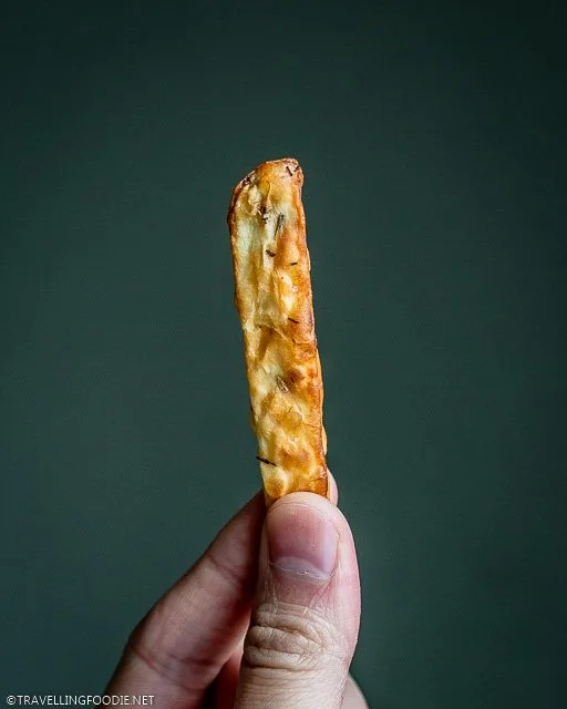 Holding a piece of crispy french fry