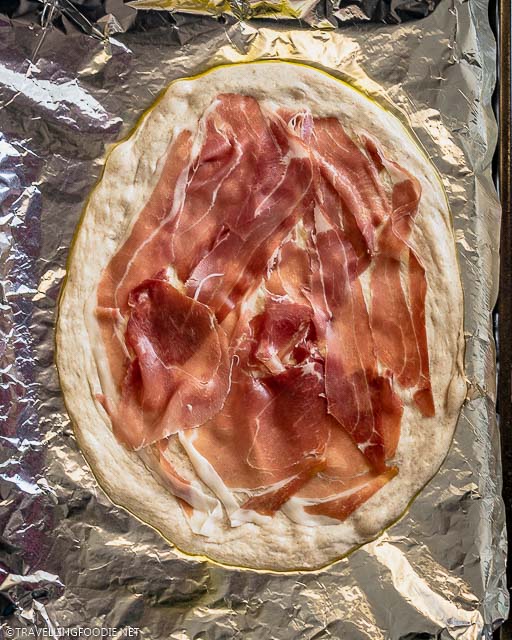 Raw Pizza Dough topped with Prosciutto di Parma
