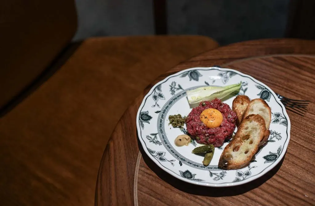 Toronto Signature Recipes: REIGN Restaurant Beef Tartare on table at Fairmont Royal York Toronto