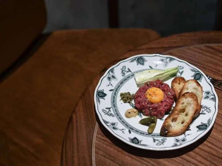 REIGN Restaurant Beef Tartare on table at Fairmont Royal York Toronto