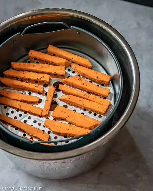 Raw Sweet Potato Fries on Air Fryer Basket of Instant Pot Duo Crisp