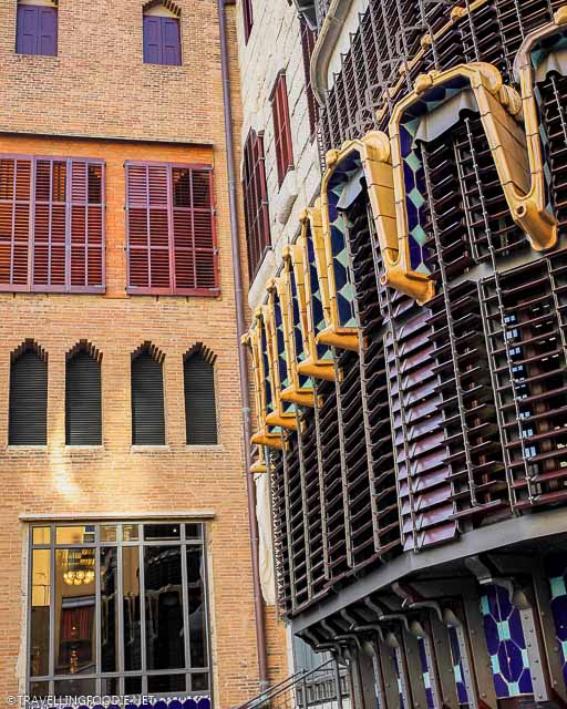 The rear facade of Palau Güell with bay windows and folding shutters