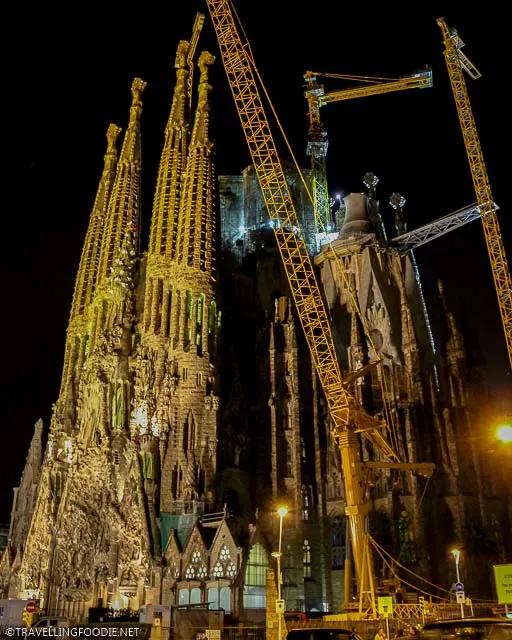 Full side-view of La Sagrada Familia construction at night