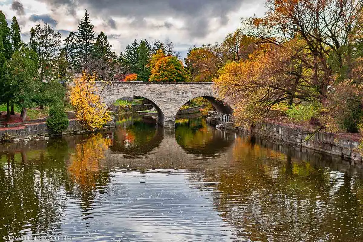 Ontario's oldest double-arch stone bridge during Fall at the Shakespearean Gardens in Stratford
