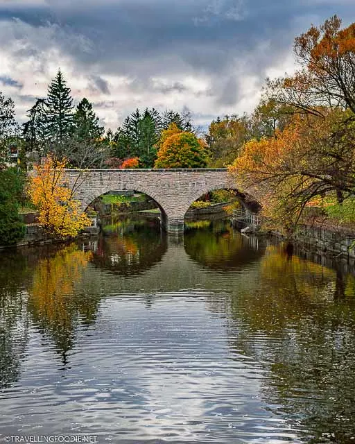 Ontario's oldest double-arch stone bridge at the Shakespearean Gardens in Stratford in Fall