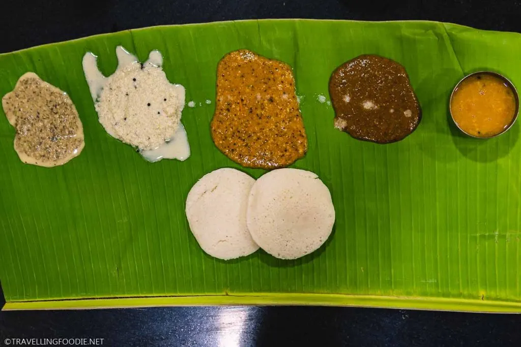 Idli with chutneys and sauces at Murugan Idli Shop in Madurai, India