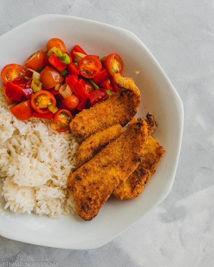 Air Fried Battered Basa Fish on Plate with Rice and Salsa Fresca