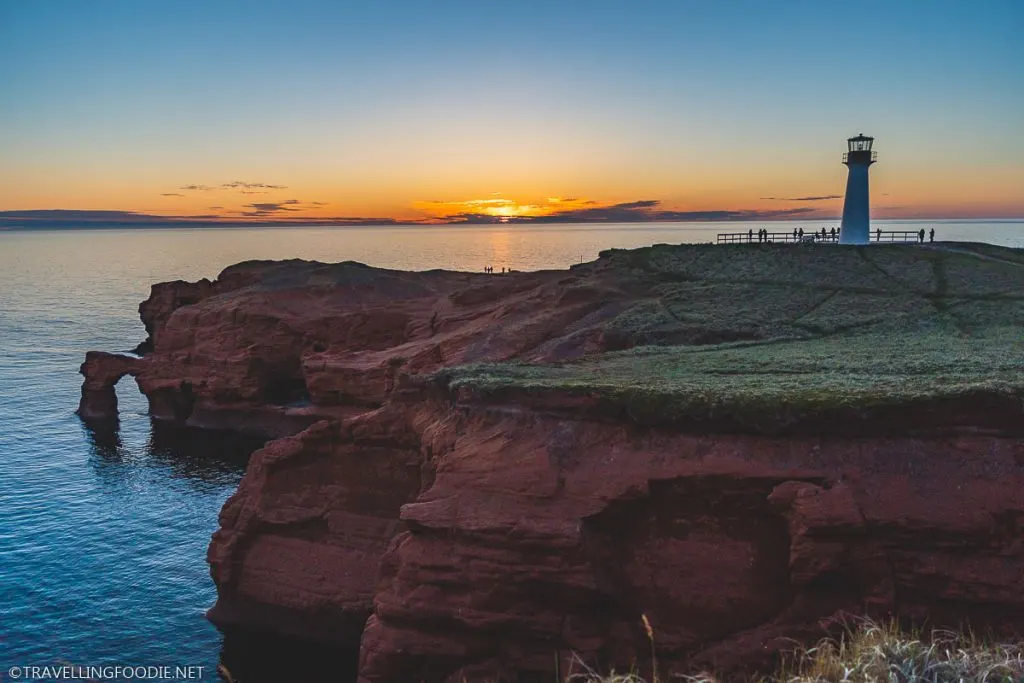 Borgot Lighthouse with red sandstone cliffs in Magdalen Islands