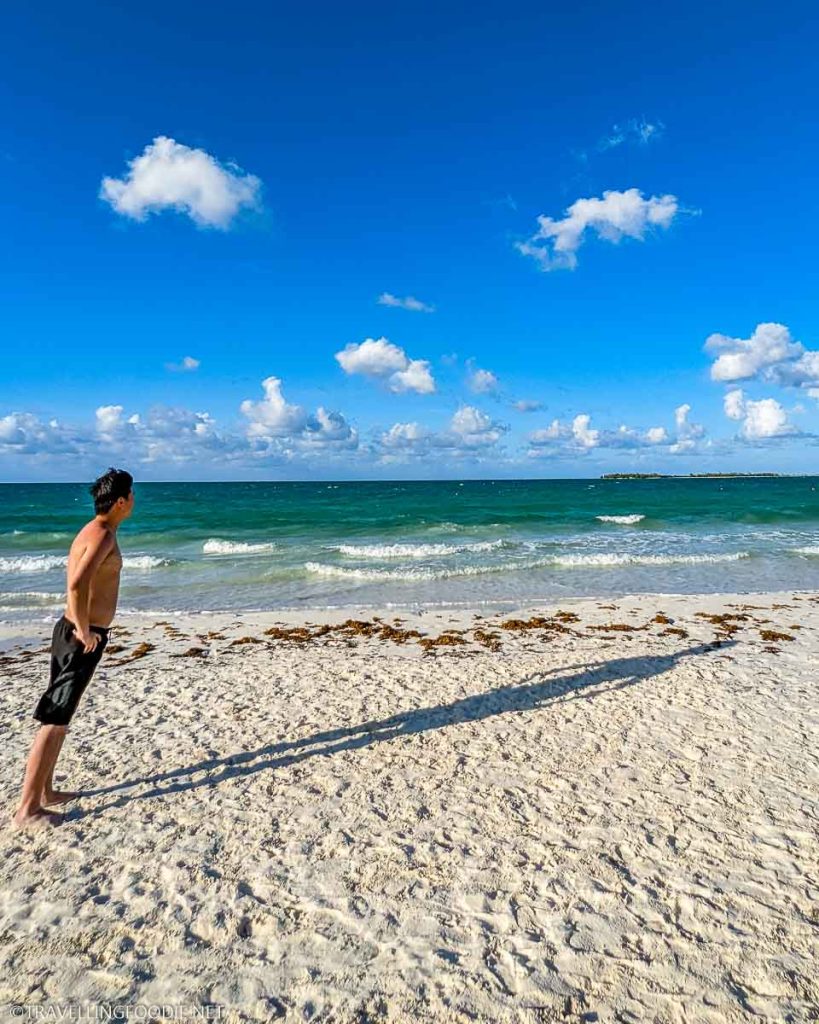 Travelling Foodie Raymond Cua standing at Playa Pilar Beach in Cayo Guillermo, Cuba