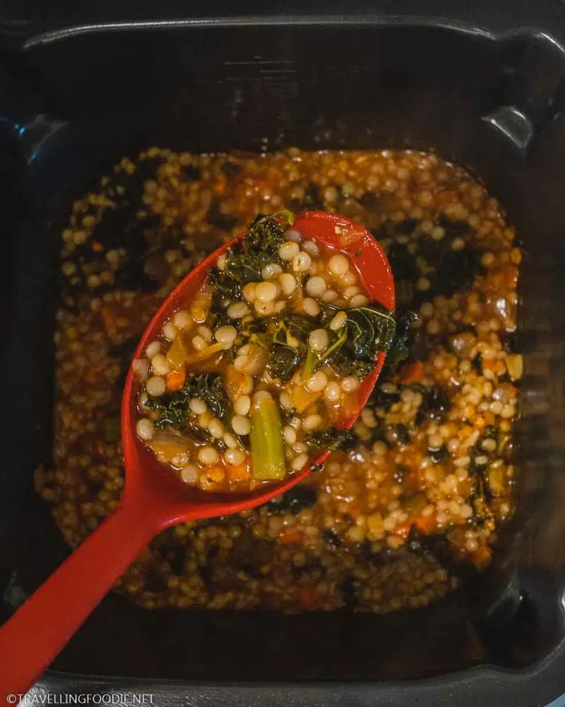 Italian couscous soup on ladel