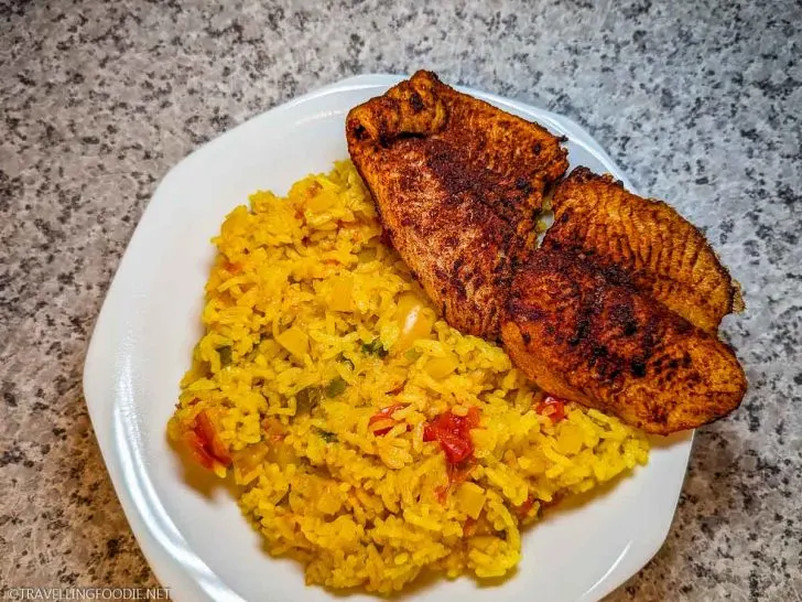 Mexican-style Fish and Golden Rice on Plate