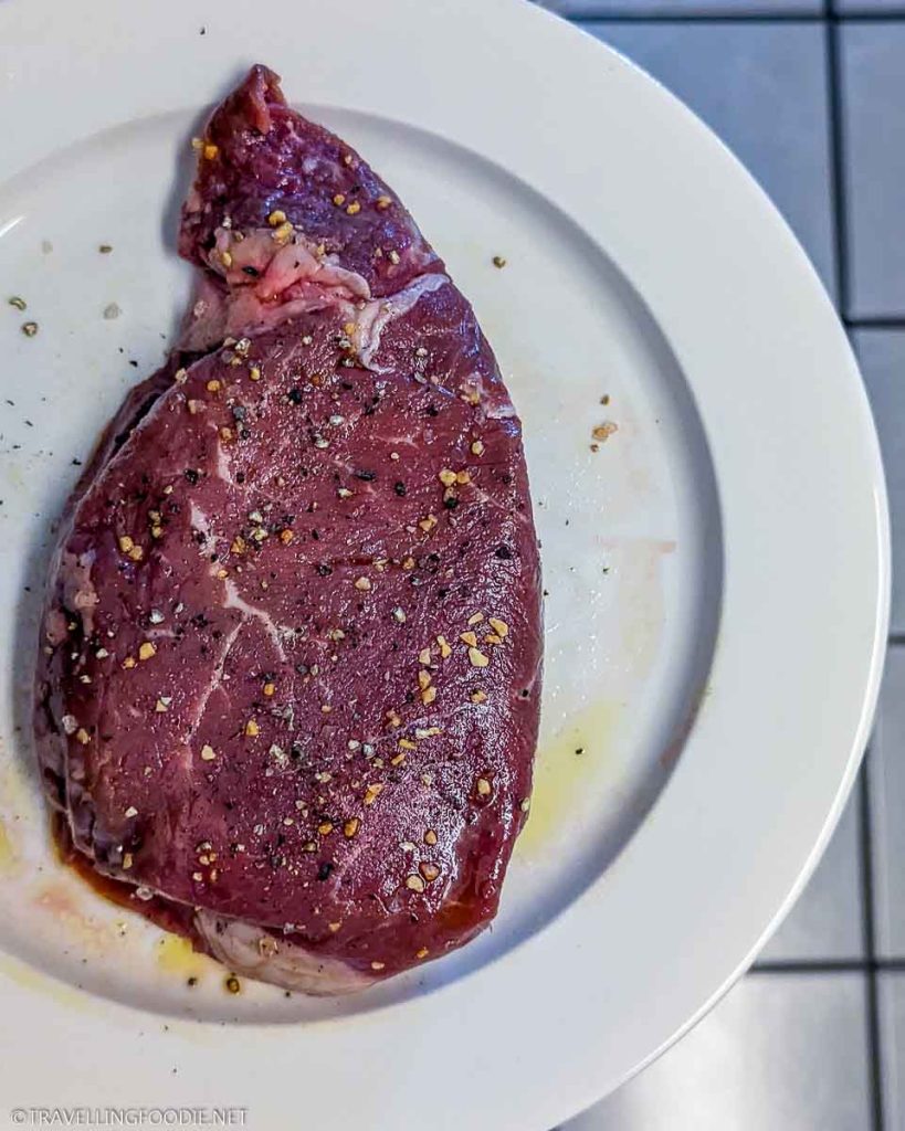 seasoned raw striploin steak