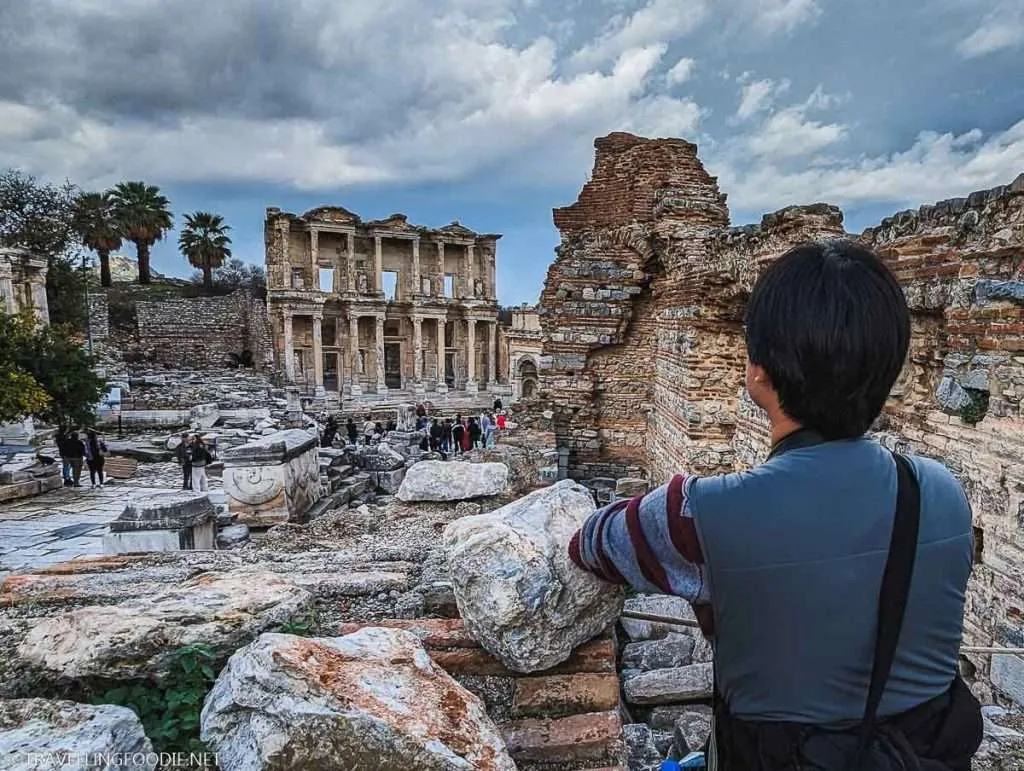 Travelling Foodie Raymond Cua looking over the Library of Celsus at Selcuk, Turkey