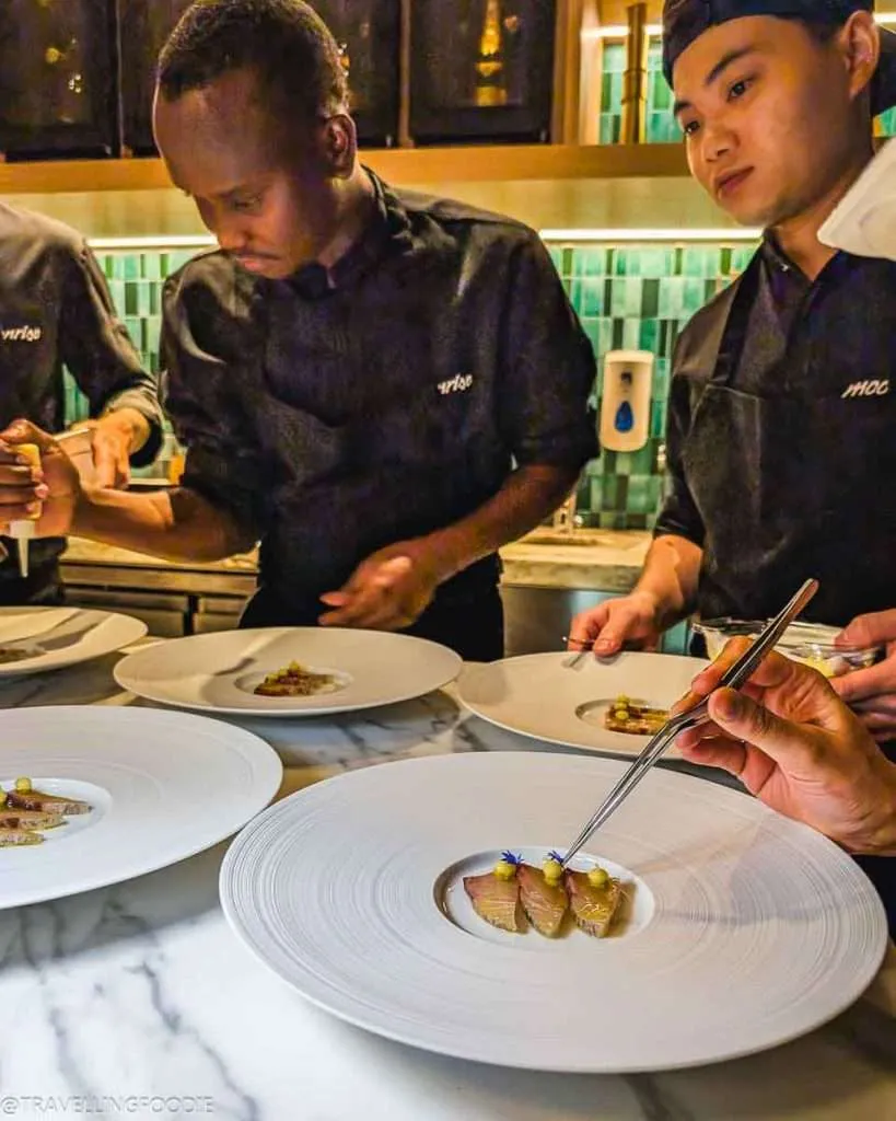 Chefs making fish course at Moonrise, One Michelin Star Restaurant in Dubai