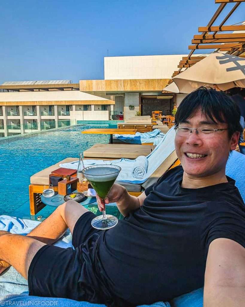 Travelling Foodie Raymond Cua holding Signature Cocktail at Tasca by Jose Avillez at Mandarin Oriental Jumeira Dubai