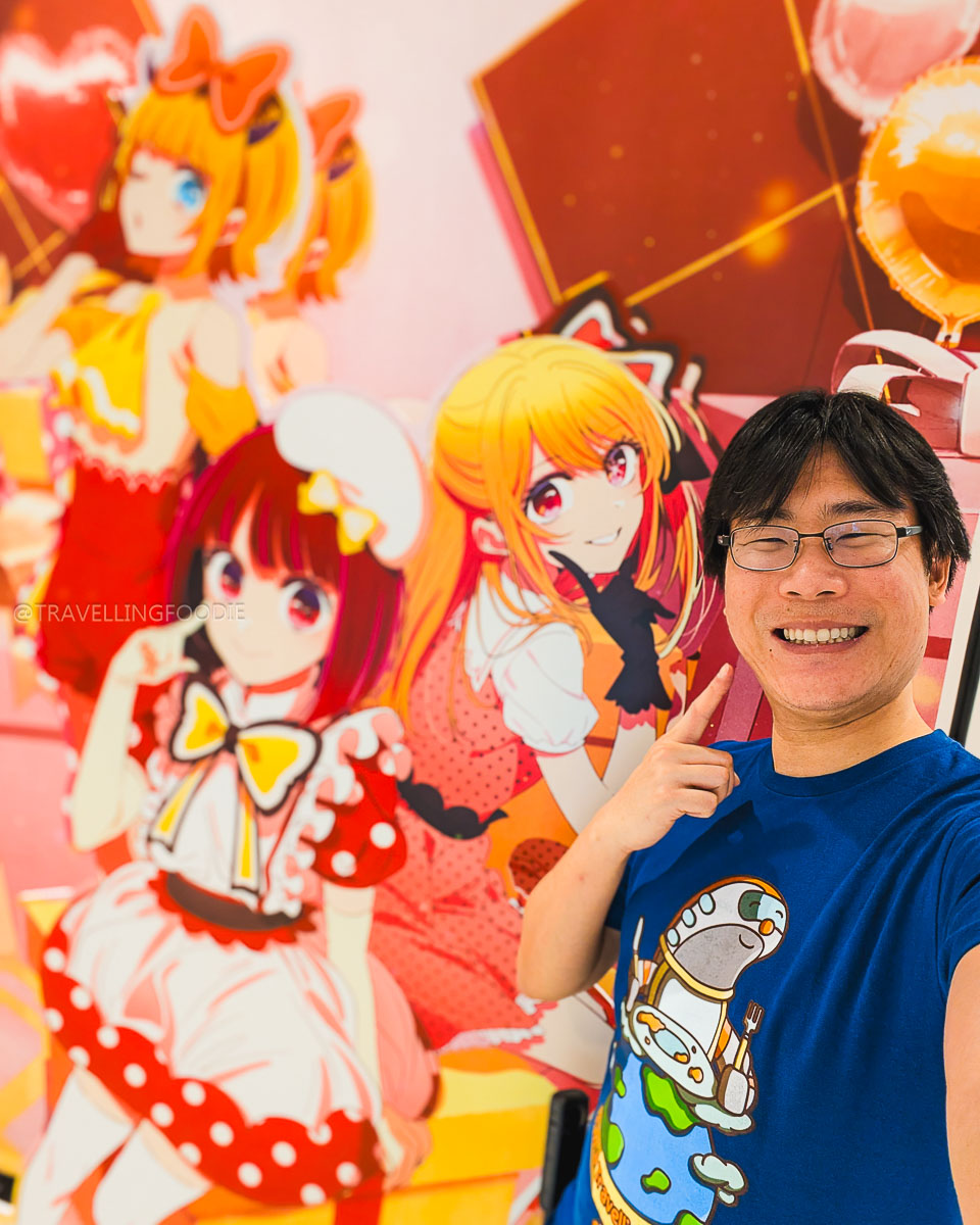 Travelling Foodie Raymond Cua posing with maids at Anime Tokyo Station in Ikebukuro