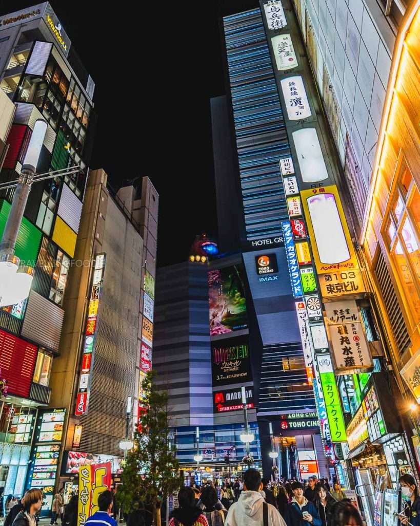 Godzilla Head with fire at Godzilla Road at night in Tokyo