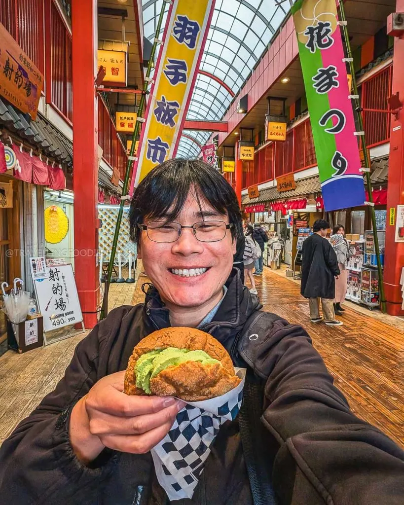 Travelling Foodie Raymond Cua enjoying matcha melonpan at Kagetsudo in Asakusa, Tokyo