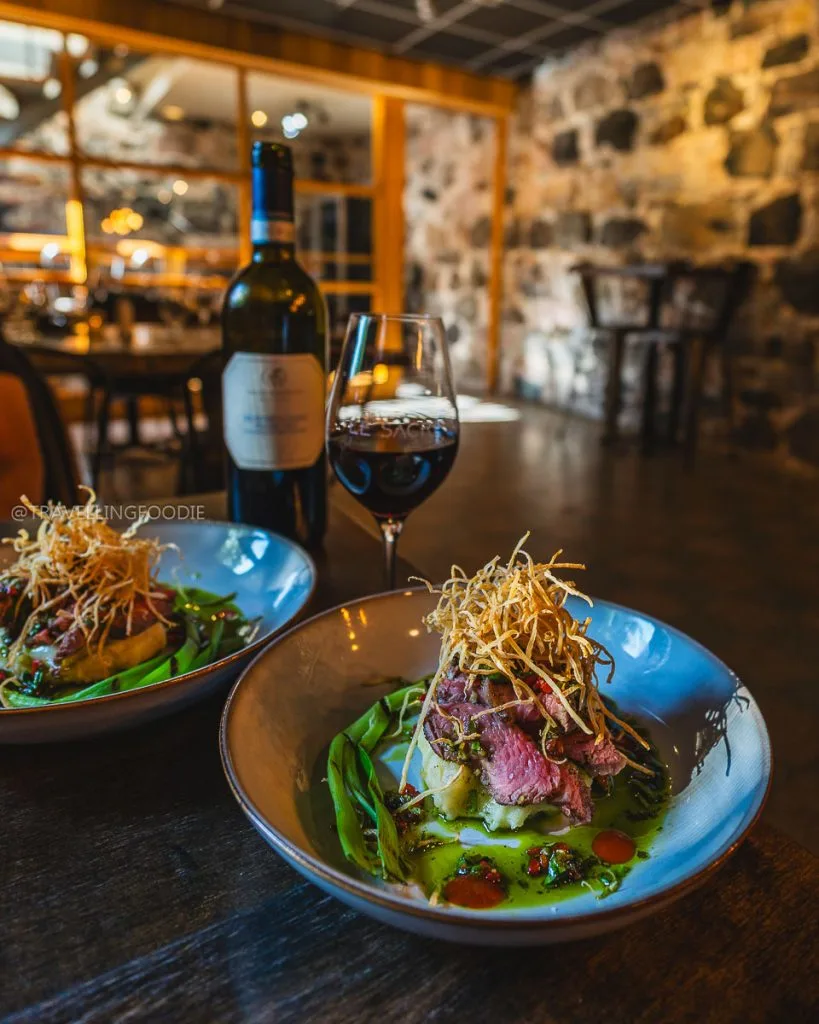 Main Course and Red Wine at Le Sacre Bistro, one of the best restaurants in Oka