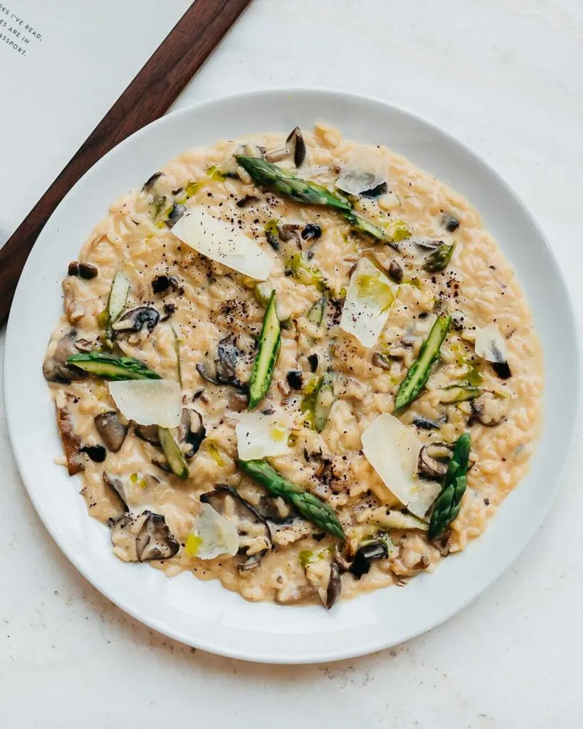 Chef Julian Laffargue's signature Wild Mushroom Risotto garnished with balsamic glaze at Ricarda's Toronto.