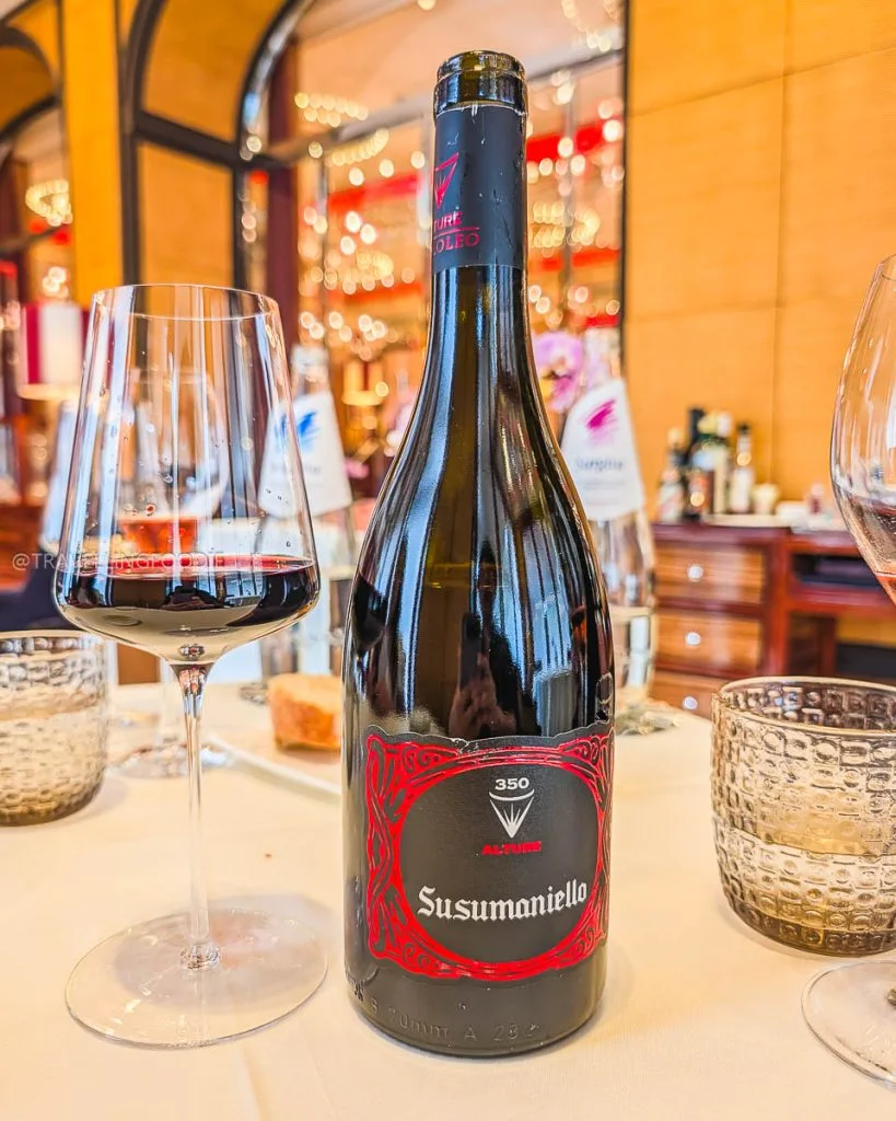 Alture Susumaniello red wine bottle paired with beef fillet course at Ristorante Acanto Milan.