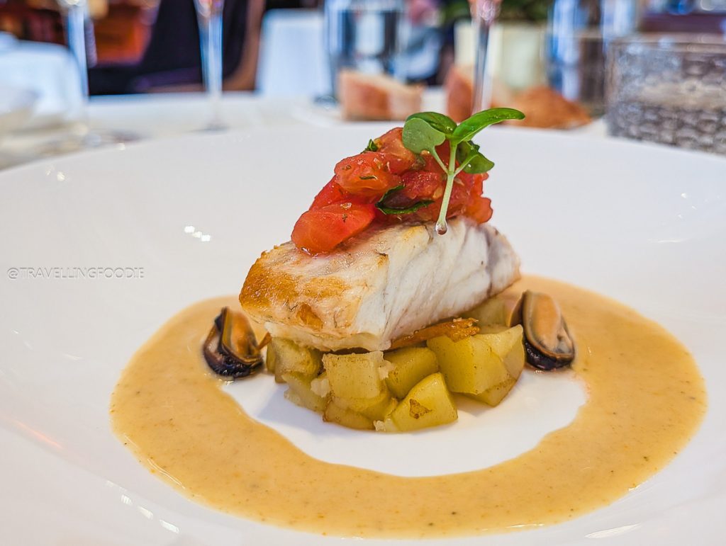 Close up of sea bass fillet with roasted tomato pesto at Acanto Restaurant Milan.