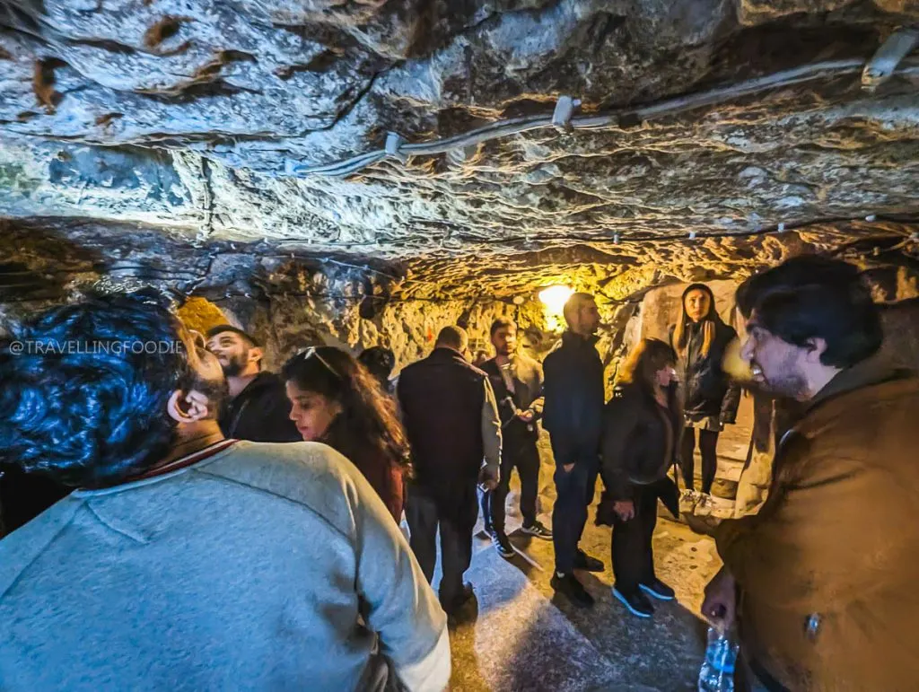 Tourists exploring a cavern inside Derinkuyu Underground City, a top attraction on the Green Tour Cappadocia