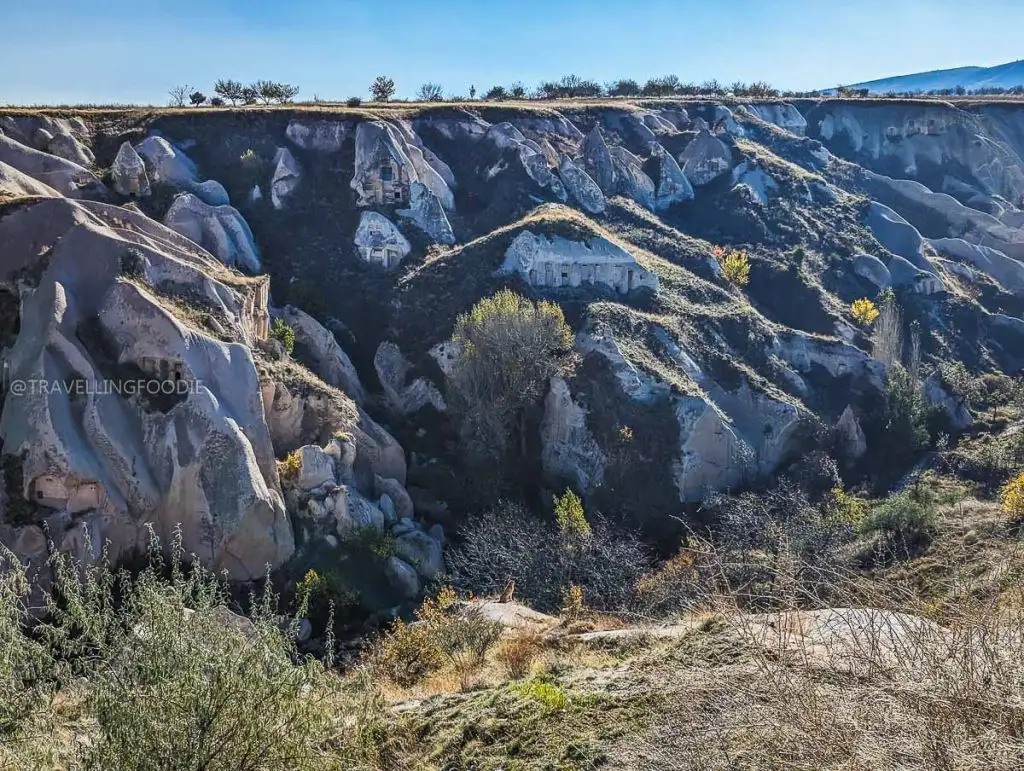 Rock faces carved with ancient pigeon houses seen at the Pigeon Valley viewpoint in Cappadocia