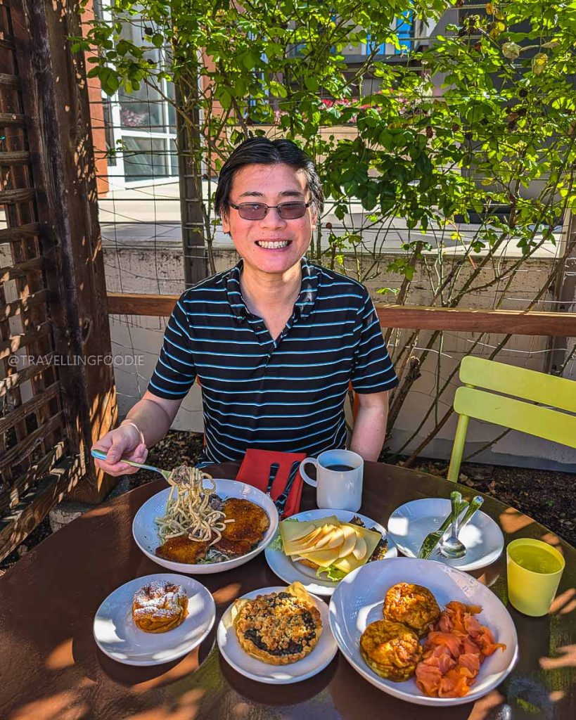 Travelling Foodie Raymond Cua eating a German pork schnitzel breakfast at Anja's Kitchen, discovering the best restaurants in Berkeley.