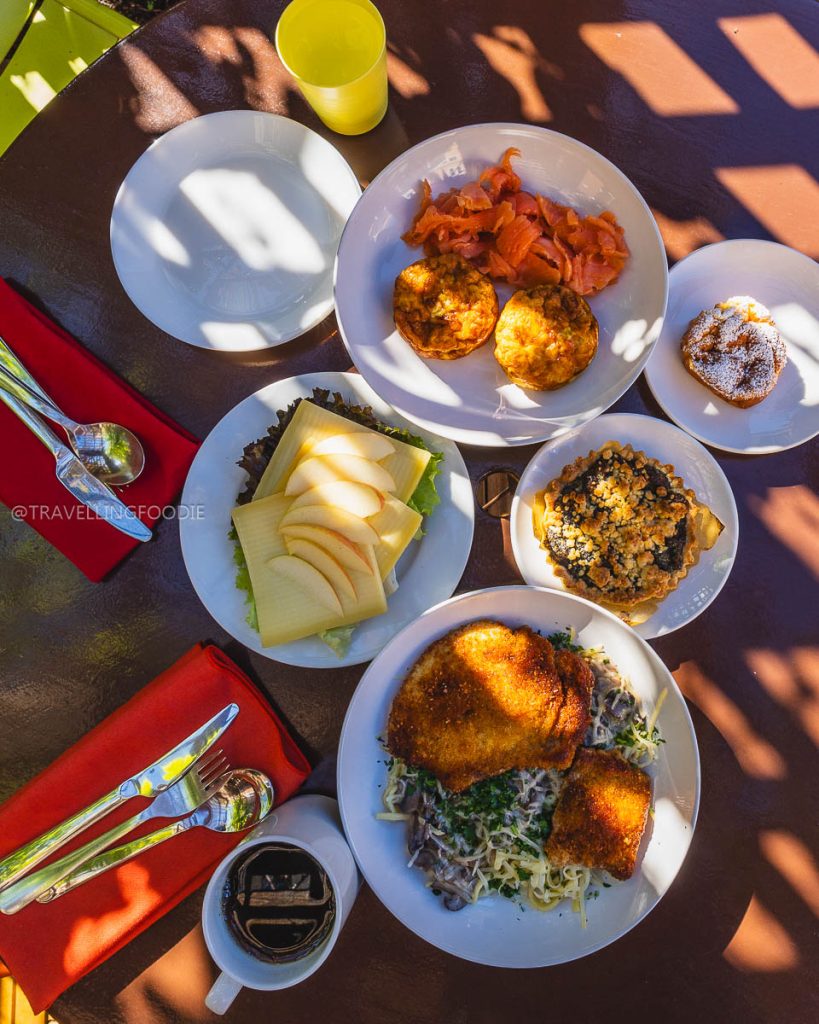 An authentic German breakfast spread with pork schnitzel at Anja's Kitchen, highlighting top Berkeley food.