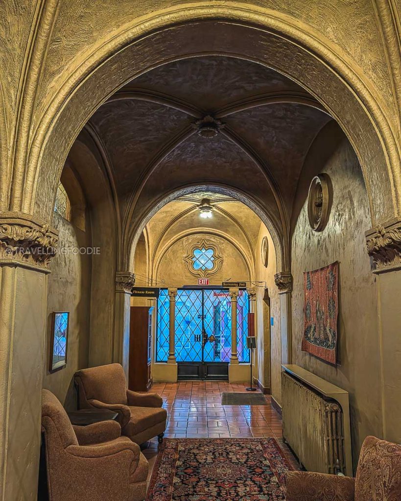 Hallway leading to the historic indoor pool at the Berkeley City Club, perfectly located near places to eat in Berkeley.