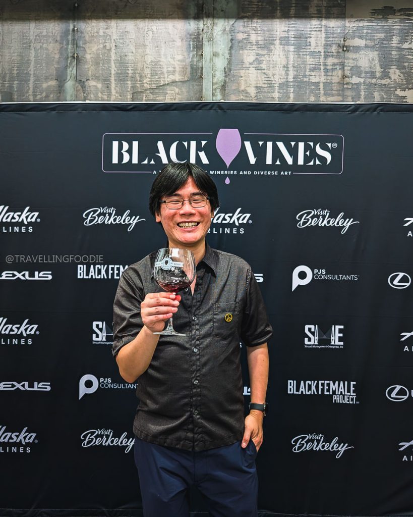 Travelling Foodie Raymond Cua tasting wine at the Black Vines event, a top Berkeley food and drink experience celebrating Black-owned wineries.