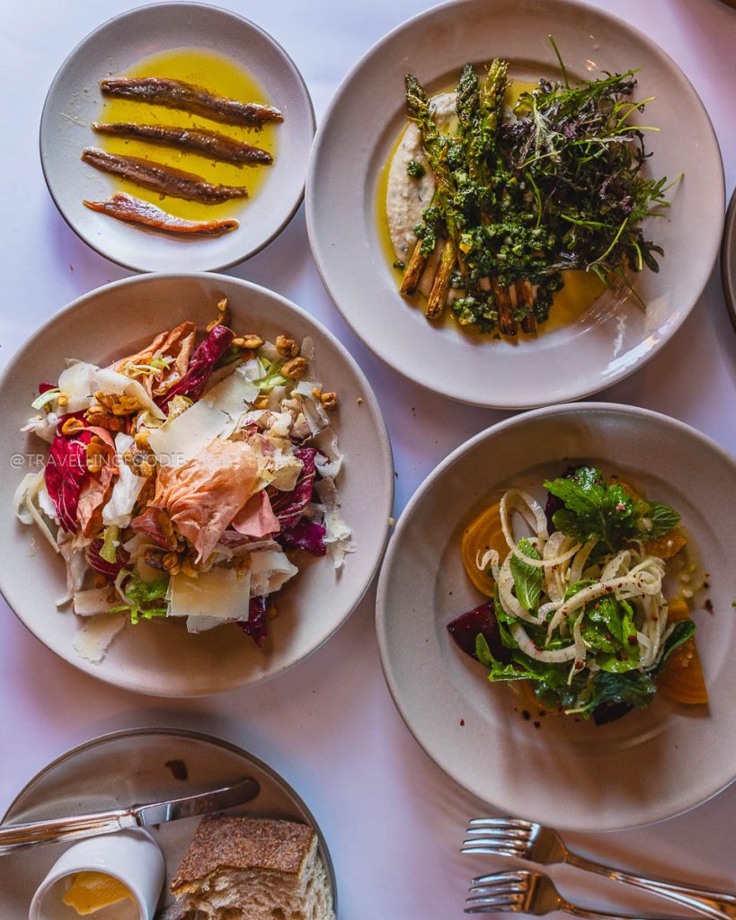 Fresh seasonal salads and roasted asparagus at Chez Panisse, showcasing the best Berkeley food scene.