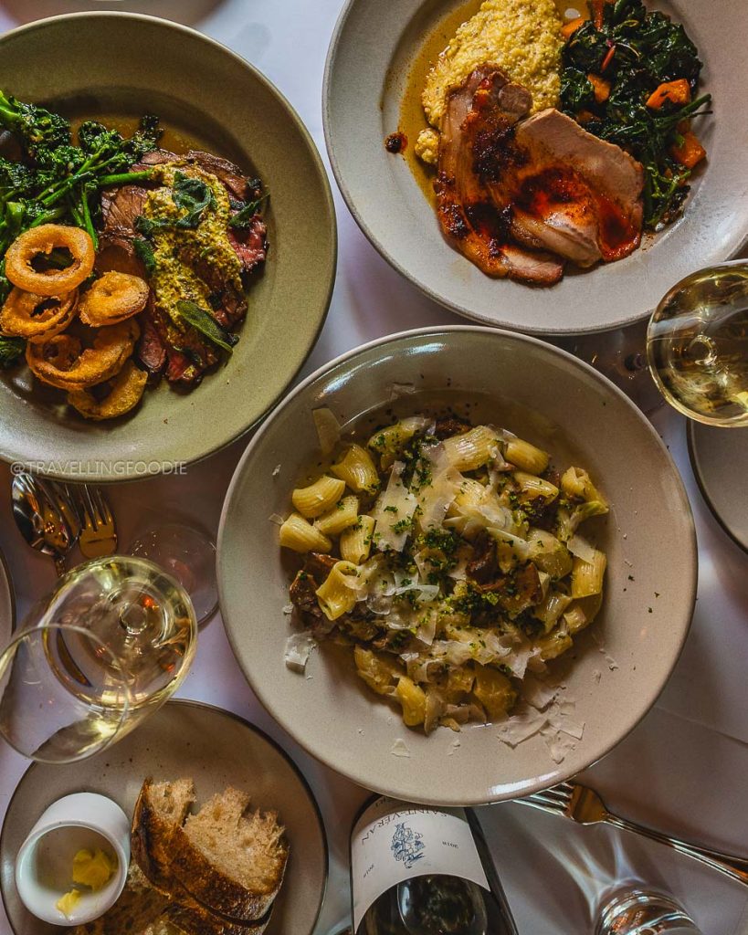 Gourmet rigatoni, lamb leg, and roasted pork loin at Chez Panisse, a historic place to eat in Berkeley.