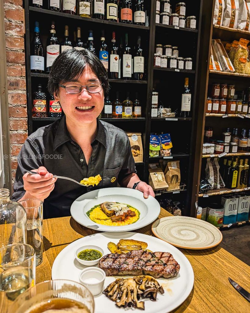 Travelling Foodie Raymond Cua dining on risotto and dry-aged steak at Donato and Co, one of the best Italian restaurants in Berkeley.