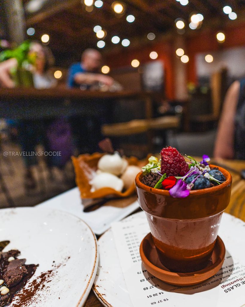 The unique potted peach sabayon dessert at Donato and Co, featuring specialty food and drinks in Berkeley.